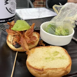 The grilled chicken with avocado sandwich complete with broccoli wrapped in a plastic bag...