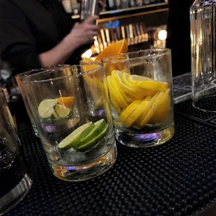 a bar with a bartender in the background