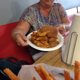 a woman holding a plate of food