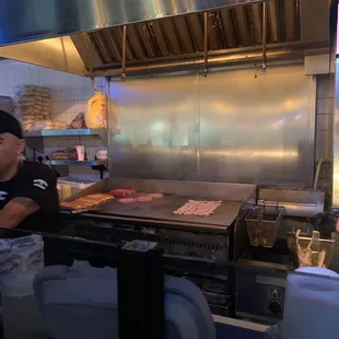 a man in a restaurant kitchen