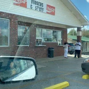 a car parked in front of a restaurant