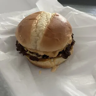 The American burger. Comes with cheese only and packets of ketchup and mustard if you want