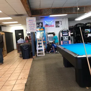 a pool table and arcade