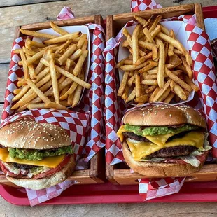 two trays of fries and a cheeseburger