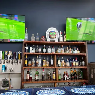 a bar with a lot of bottles of beer