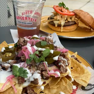 Big Tex Nachos (with beef patty)   Iced Tea  Chile con Queso Burger