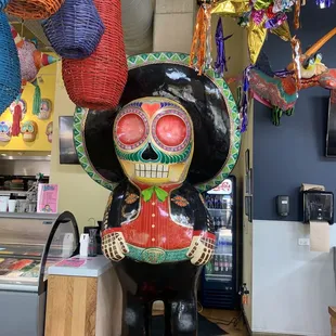 Mariachi muerto greets you at the entrance