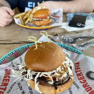 The Al Pastor Al Burger and Hambugesa. The Al Pastor Burger has grilled pineapple. Yummm