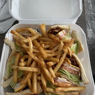 Club sandwich with well done fries.