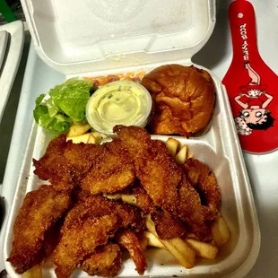 ried chicken and fries in a styrofoam container