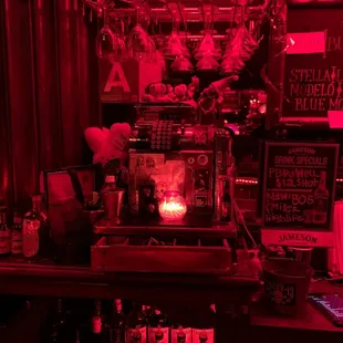 a bar with red lighting