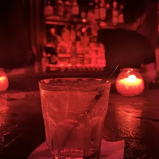 a glass of alcohol on a table