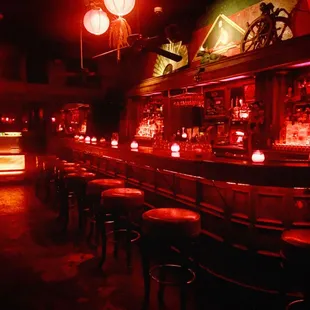 a bar with red lighting