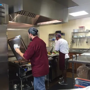 two men in a commercial kitchen