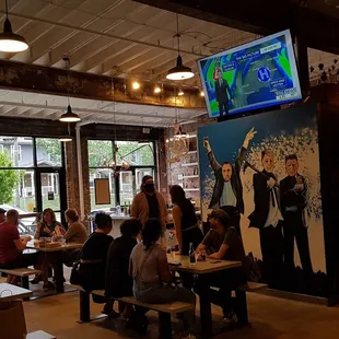 a large group of people sitting at tables