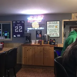 a woman sitting at a bar