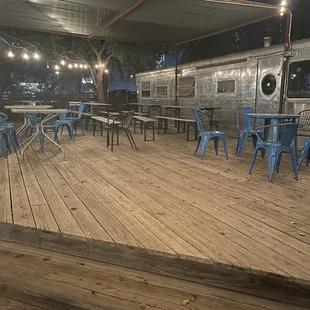 More outdoor seating.  Not sure what the silver bullet camper is for if anything.
