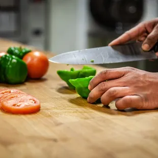 a person chopping vegetables
