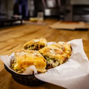 a basket of food on a wooden table
