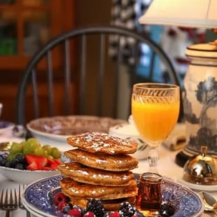 Our gourmet breakfast is served at individual tables, and guests choose from a wide and varied menu. Pictured: Gingerbread Pancakes