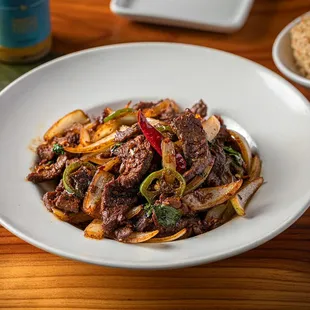 a plate of beef and vegetables