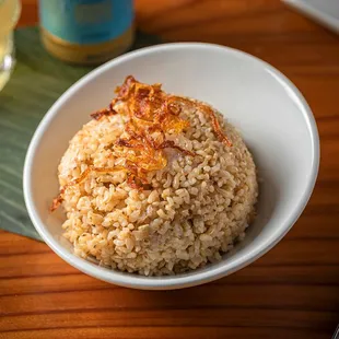 a bowl of rice and a fork