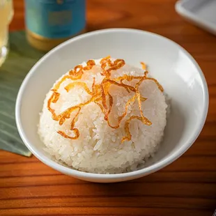 a bowl of rice and a fork