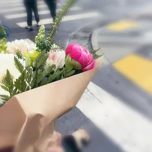 On our way to the restaurant with flowers for friend&apos;s birthday lunch!