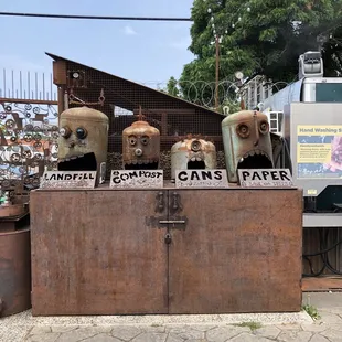 a pile of old gas cans