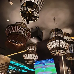 a group of chandeliers hanging from the ceiling