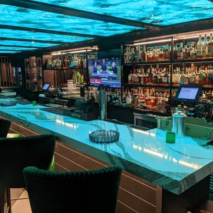 a bar with a lot of bottles