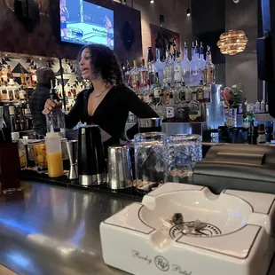 a woman behind the bar