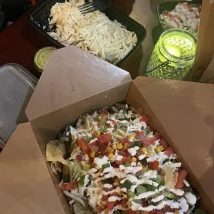 Chicken Alfredo with side salad and loaded nachos