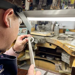 Goldsmith working on a repair