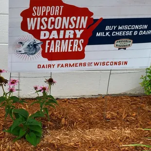 a sign in front of a building