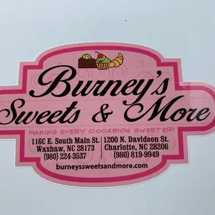 a pink and white sign