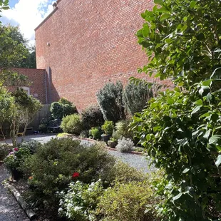 a brick wall and garden
