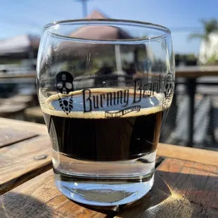 a glass of beer on a table