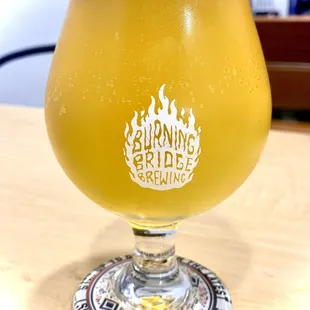 a glass of beer on a table