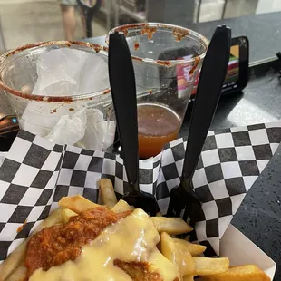 Chorizo chill-cheese fries- yummy!!! Paired with a Michelada can't go wrong