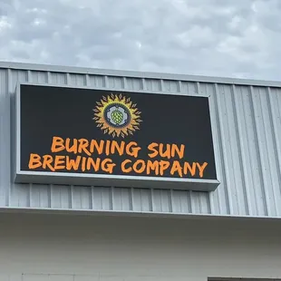 a sign for burning sun brewing company