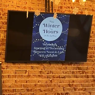 a television mounted on a brick wall