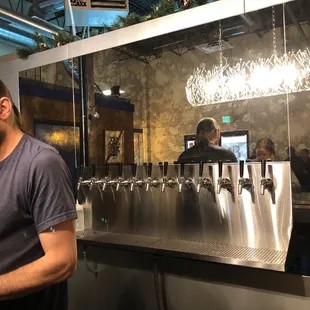 Head brewer and owner Wayne Burns discussing creations with customers.