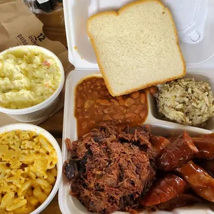 Brisket, spicy sausage,dirty rice, Mac N Cheese, Potato salad...