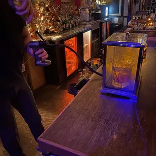 a man standing at a bar