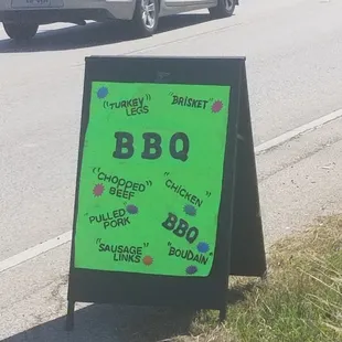a sign on the side of the road