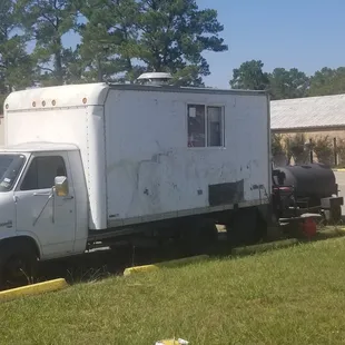 a white truck parked in a parking lot
