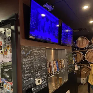 a man standing in front of a bar