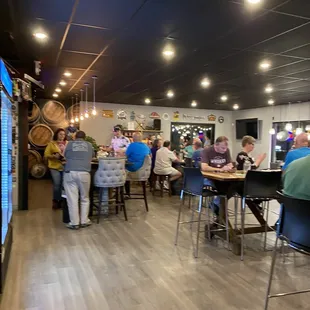 a group of people sitting at a bar