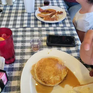 a family eating breakfast at a restaurant